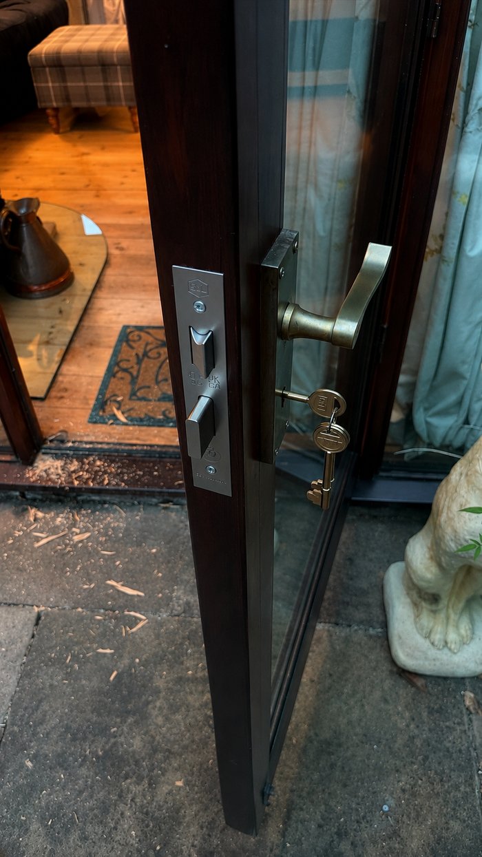 New satin lever handle and lock fitted to the same glazed timber door