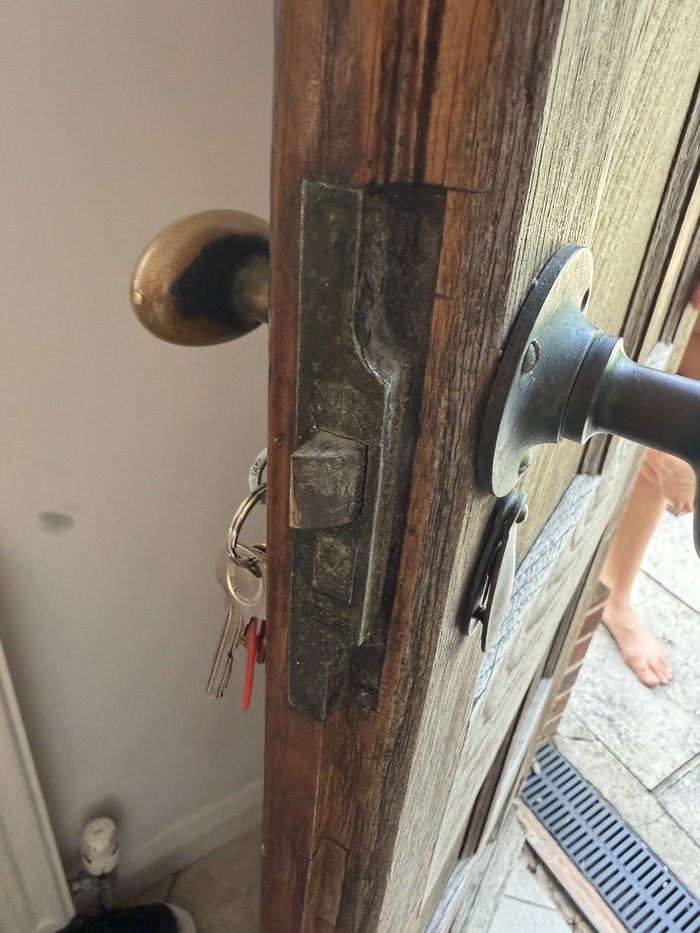 Old mortice lock and latch on a solid wooden period door